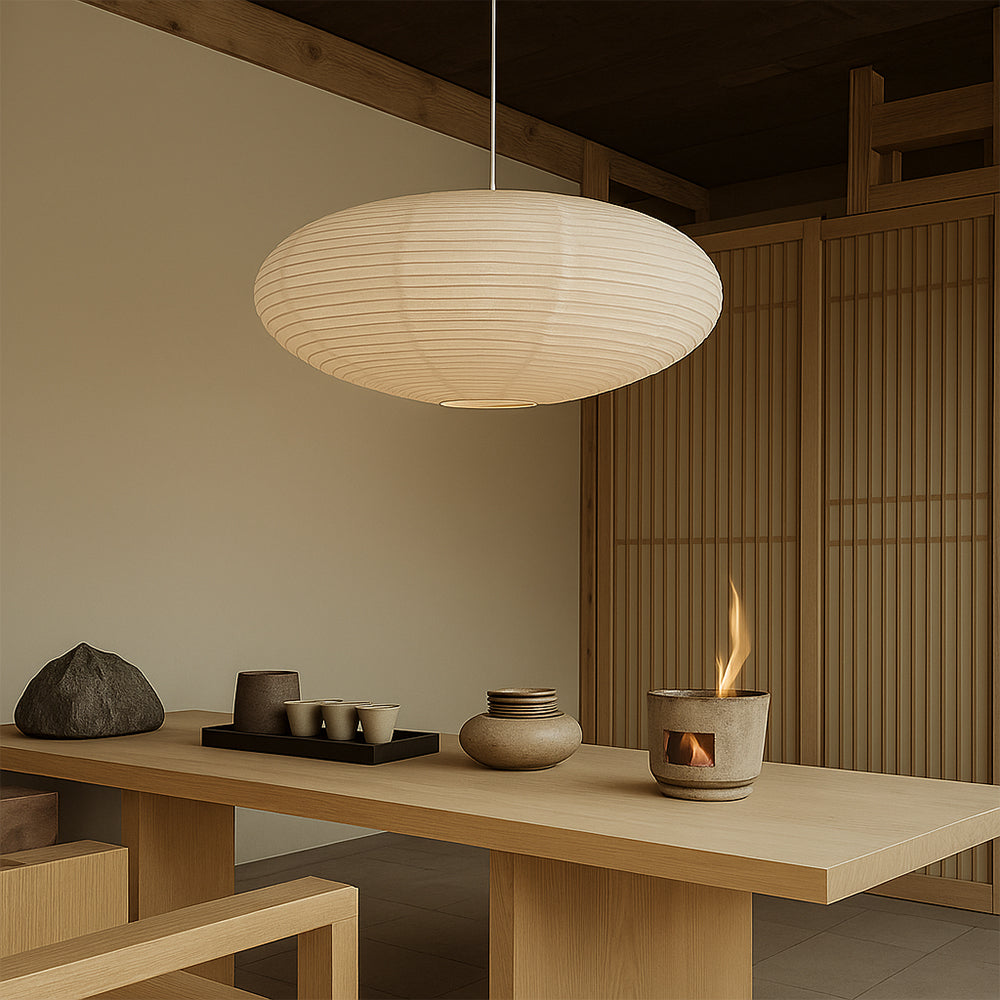 Modern interior with a pendant light, wooden table, and decorative items.